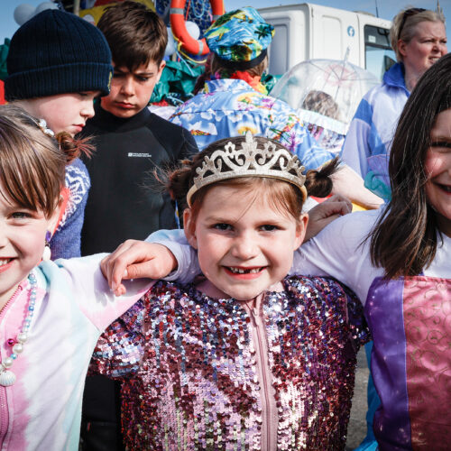 Children at an event pose for a photograph